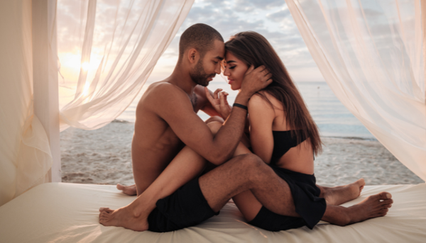 Couple sharing an intimate moment showing natural connection and arousal