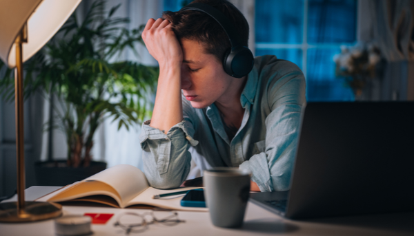 man feeling stressed and mentally exhausted