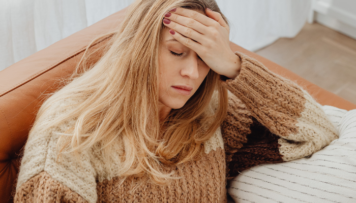 woman feeling stressed before using CBD pills