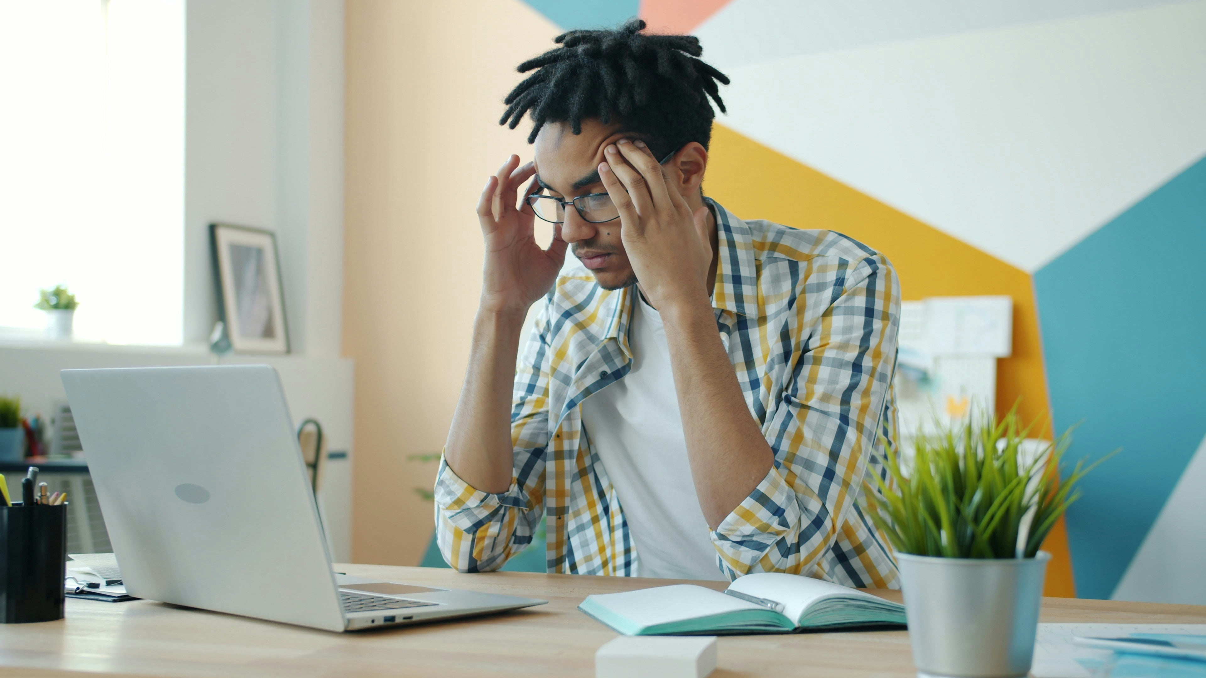 anxious person working at a computer