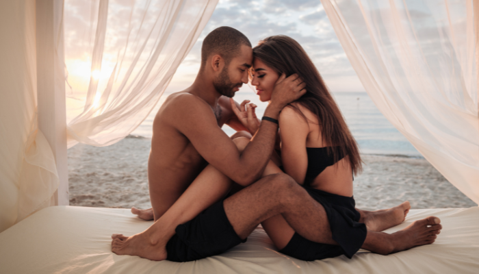 Couple sharing an intimate moment showing natural connection and arousal
