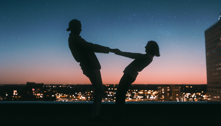 Couple enjoying a romantic stargazing date night